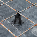 Close-up view of durable plastic mesh spacers applied in ground slab reinforcement