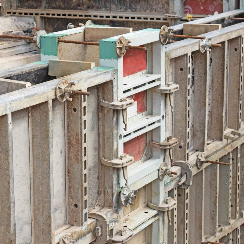 Completed installation of formwork tie bars in a newly constructed concrete structure.