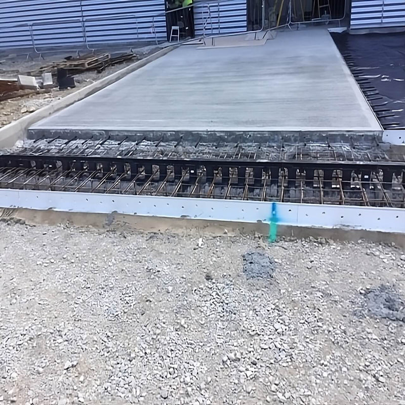 Concrete slab drainage system implemented using K-Form screed rails