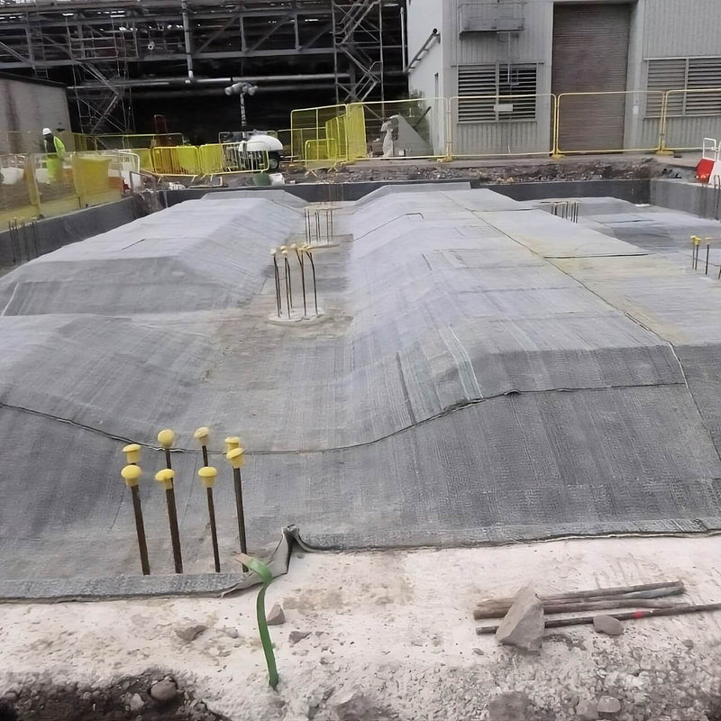 Bentonite Membrane setup underway at a construction site for waterproofing