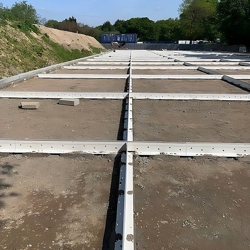 K-FORM screed rails set up for large-scale industrial use, providing robust formwork solutions for precise concrete levelling