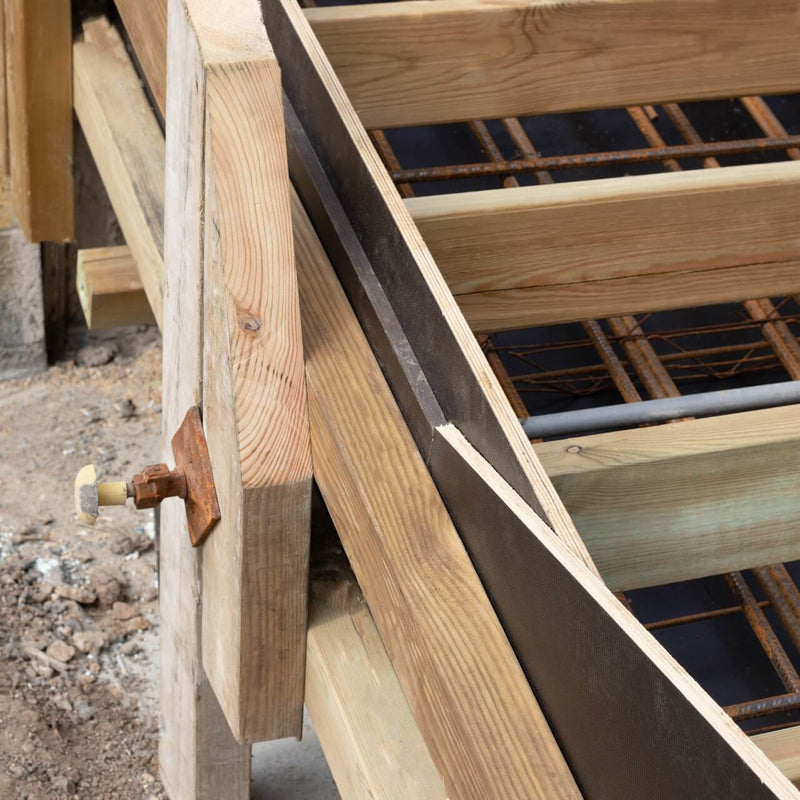 On-site application of tie-bar sleeve in formwork, showcasing efficient tie bar spacing