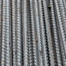 Close-up view of steel reinforcement bar texture, highlighting construction material detail.