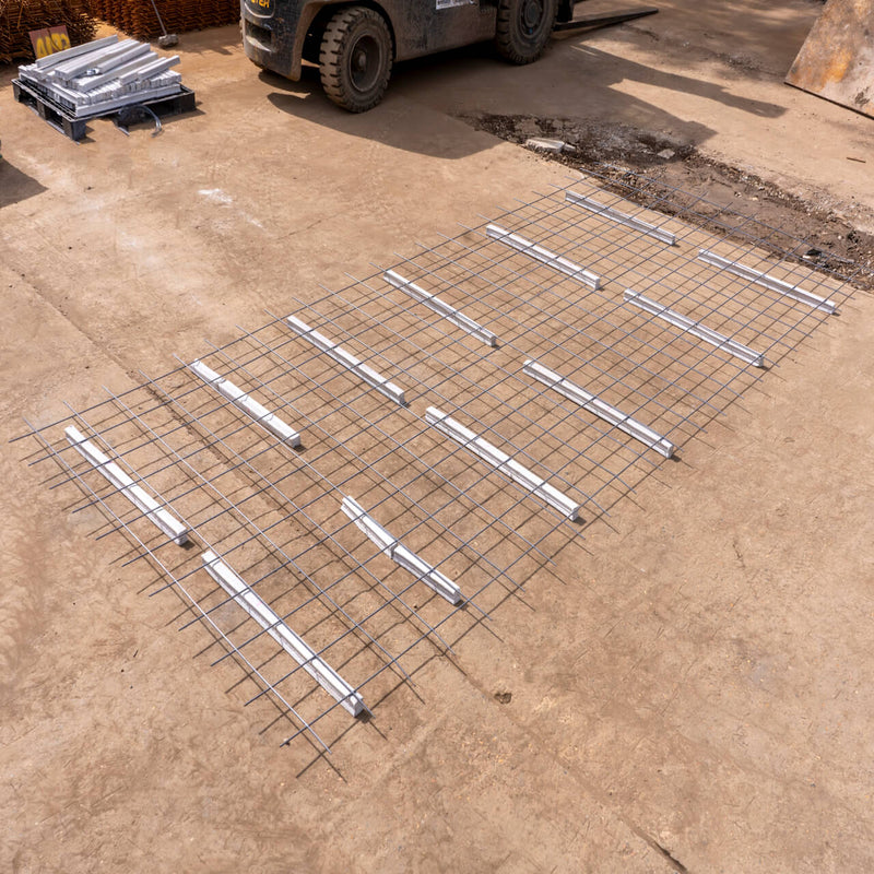 Square bar spacers used in concrete construction to ensure precise reinforcement alignment and structural integrity