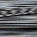 Piled of steel reinforcement bars, ready for deployment in structural projects.
