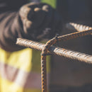 Detailed view of steel wire tightly fastened around rebar